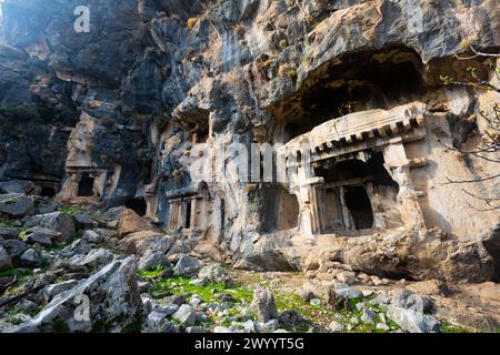 Lycian rock hewn tombs carved into mountainside in Pinara, Turkey Stock Photo