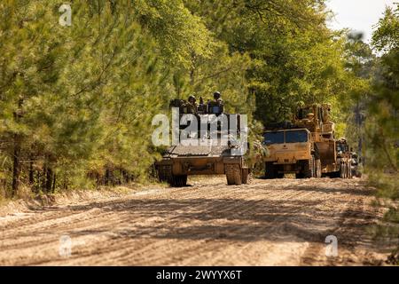 Soldiers assigned to 1st Battalion, 64th Armor Regiment, 3rd Infantry Division, conduct security operations from a Bradley Fighting Vehicle during Marne Focus at Fort Stewart, Georgia, April 7, 2024. Marne Focus is a key component of the division’s efforts to train and equip forces to maintain our competitive advantage, and fight and win in conflict. (U.S. Army photo by Pfc. Santiago Lepper) Stock Photo