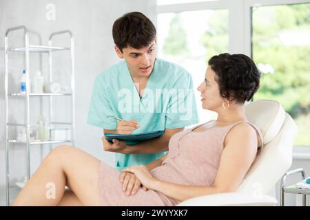 female patient documents signing Stock Photo