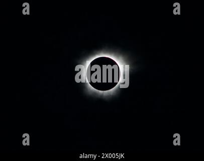 corona around the sun in a total solar eclipse in Texas on April 8, 2024 with flares showing Stock Photo
