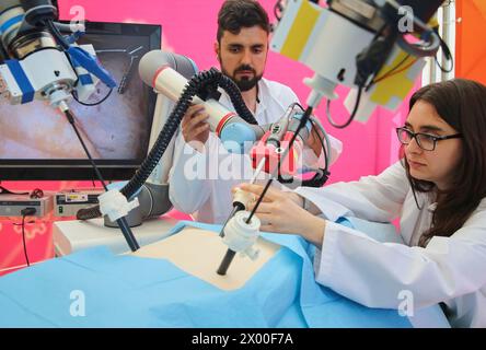 Development of a surgical robot with 3D vision and tactile sensations. This project has relied on the advice of surgeons for the design and manufacture of the device. The aim of this collaboration between engineers and doctors it was to provide benefits and added value in the field of laparoscopic surgery. The robot comprises three arms that can operate both as a coordinated individually and therefore the surgeon may adapt according to the needs of each operation. Powered by Tecnalia Research & Innovation, University of Córdoba and the Institute of Biomedical Research Maimonides of Cordoba (IM Stock Photo