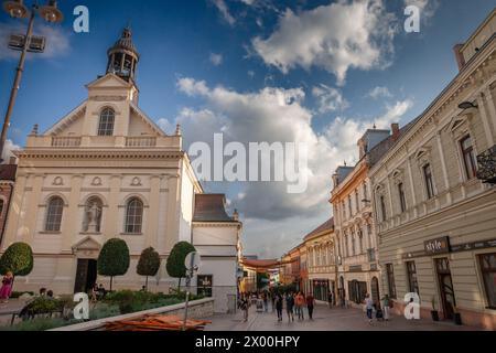 Picture of the pedestrian street irgalmasok utcaja of Pecs, Szechenyi ter square street in Pecs, Hungary, with the saint sebastian street of pecs. The Stock Photo