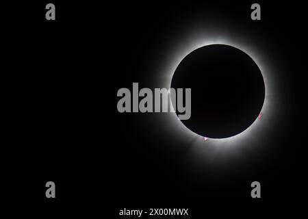 Plattsburgh, USA. 8th Apr, 2024. A woman watches a solar eclipse at ...