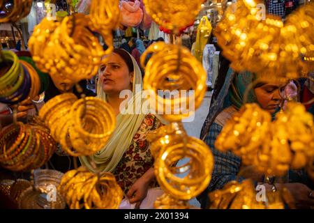 Srinagar, India. 08th Apr, 2024. Kashmiri Muslim women check bangles at a jewellery shop ahead of the Muslim festival Eid-Al-Fitr at a local market in Srinagar. Markets across the Muslim world witness huge shopping rush in preparation for Eid Al-Fitr, a celebration that marks the end of the Muslim fasting holy month of Ramadan. (Photo by Faisal Bashir/SOPA Images/Sipa USA) Credit: Sipa USA/Alamy Live News Stock Photo