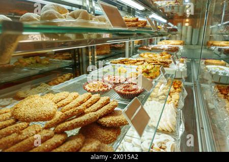 Delectable Assortment of Pastries and Sweets on Display at a Bakery Shop Stock Photo