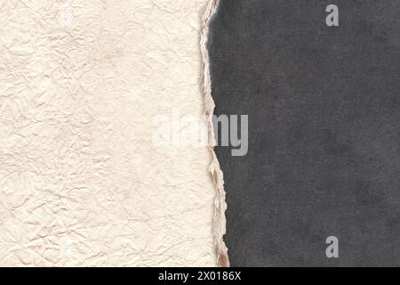 Horizontal background with torn paper edge. Cardboard texture of black color and crumpled paper of light brown color. Copy space for text Stock Photo