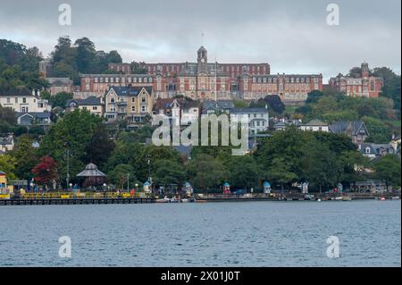 The Britannia Royal Navy College on the hillside behind Dartmouth, Devon, England, UK as seen from the River Dart while on a boat trip. Stock Photo