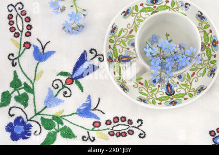 Forget-me-nots Flowers In Cup, On Blue Background Stock Photo - Alamy