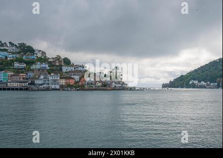 The view looking towards Kingswear and the entrance to Dartmouth harbour, Devon, England, UK as seen from the River Dart while on a boat trip. Stock Photo