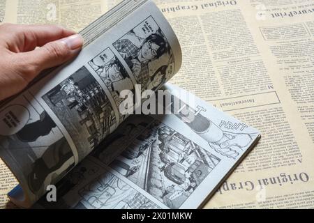 August 31, 2023, Close-up of an open comic book with bokeh background. Wadaslintang, Wonosobo Stock Photo