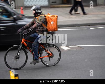 Just Eat Food delivery cyclist, in Central London Stock Photo