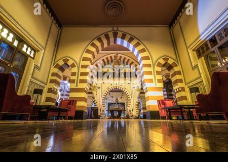 ASWAN, EGYPT - SEPTEMBER 03, 2017: The entrance lounge in the 1902 restaurant at the Arabian-inspired Old Cataract Hotel. Stock Photo
