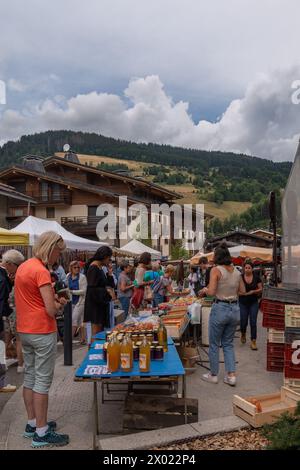 Stall selling organic food in the street market of the alpine village in summer, Megeve, Haute Savoie, Auvergne Rhone Alpes, France Stock Photo