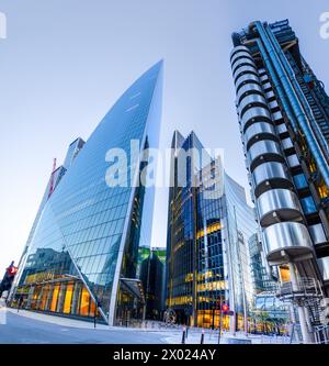 London, UK - May 20, 2023: The Lime Street in the financial district of the City of London  with the Lloyd's building, the Scalpel and Willis Building Stock Photo