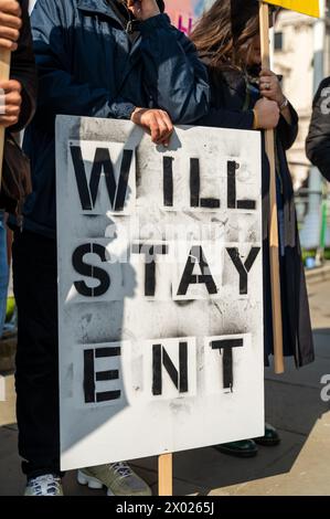 Anonymous man with signboard standing on street Stock Photo