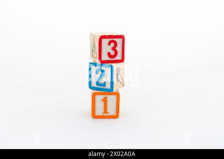 Colorful blocks with numbers stacked and isolated on a white background Stock Photo