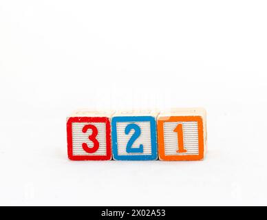 Wooden blocks with three, two and one number isolated on white background Stock Photo