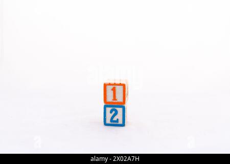 Wooden blocks number one and number two isolated on white background Stock Photo
