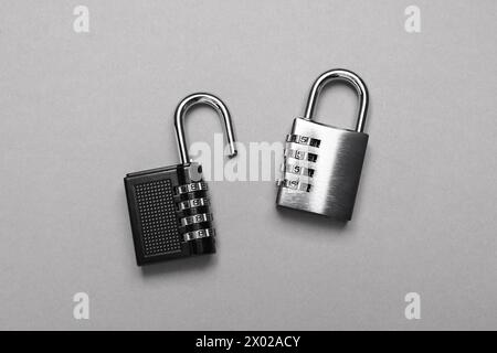 Steel combination padlocks on grey background, top view Stock Photo