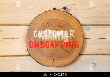 Customer onboarding symbol. Concept words Customer onboarding on beautiful wooden circle. Beautiful wooden wall background. Business Customer onboardi Stock Photo