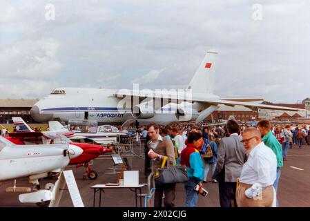 Soviet Aeroflot Antonov An-124 Ruslan transport plane CCCP-82007 on show at the 1988 Farnborough Air Show, with a variety of small aircraft on display. People. Promoting Russian aviation to the aerospace markets Stock Photo