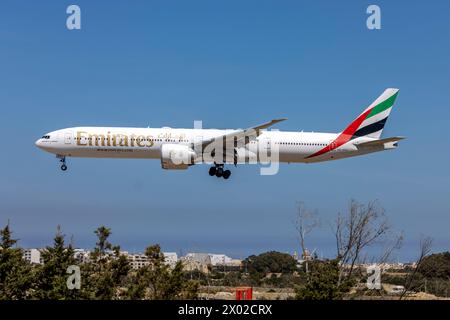 Emirates Boeing 777-31H-ER (REG: A6-EPH) on finals runway 31. Stock Photo
