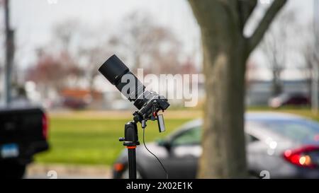 NORWALK, CT, USA - APRIL 8, 2024: Photography set up on Calf Pasture Beach for watching American eclipse Stock Photo