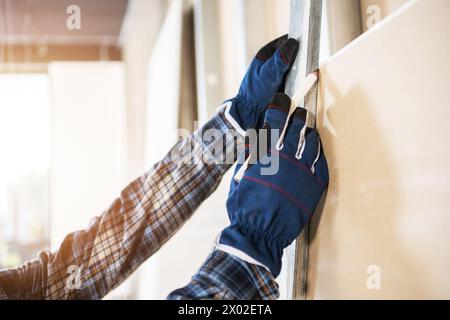 Construction Contractor Worker Marking Cutting Place Using a Pencil Close Up Stock Photo