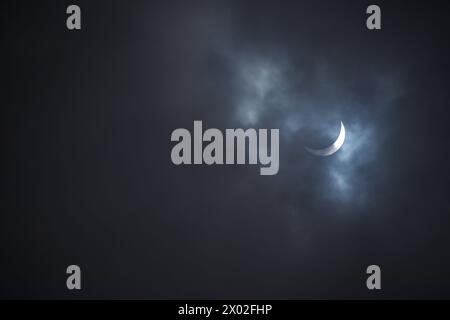 Solar Eclipse April 8th 2024 Taken in Durham region just outside Toronto, Ontario, few minutes before and after totality. Captured during cloud cover. Stock Photo
