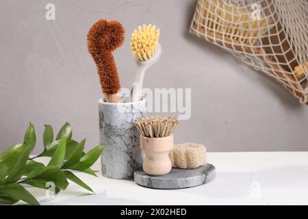 Set of cleaning brushes on white table Stock Photo