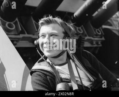 In September 1940, officers and crew served aboard the battleship HMS Rodney. An Able Seaman worked in communications for the after pom-pom gun crew and navigation party. Stock Photo