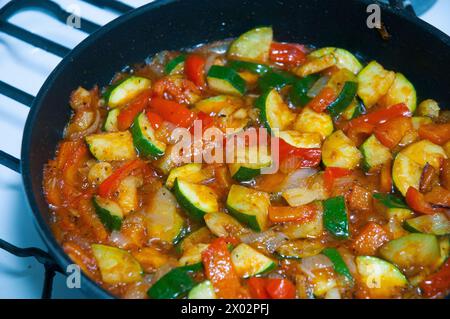 Cooking pisto manchego in a frying pan. Close view. Stock Photo