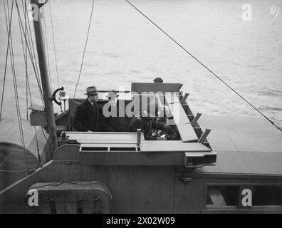 Winston Churchill traveled to America from 12 to 21 December aboard HMS Duke of York. Lord Beaverbrook and Averill Harriman were transported to the battleship by a tender during the voyage. Stock Photo