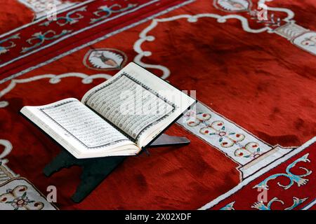 Open Quran in Arabic on wood stand, Symbol of Islam, Mubarak Mosque, Chau Doc, Vietnam, Indochina, Southeast Asia, Asia Stock Photo