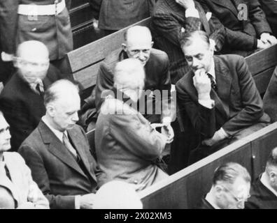 On 23 November 1945, Wilhelm Keitel and Alfred Rosenberg converse with Alfred Jodl in the courtroom during the Nuremberg Trials, conducted between November 1945 and October 1946. Stock Photo