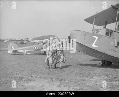 In June 1942, Wren radio mechanics and operators at the Royal Naval Air Station in Donibristle, Fife, test radio sets aboard naval aircraft to ensure reliable communication for operations. Stock Photo