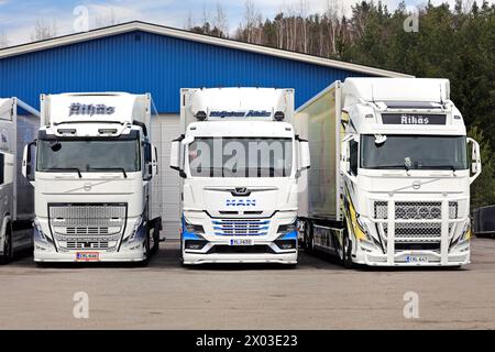 Three new, beautifully customized Volvo and MAN trucks parked on a yard on a day of spring. Salo, Finland. March 31, 2024. Stock Photo