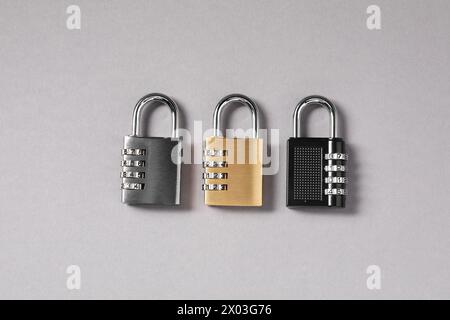 Steel combination padlocks on grey background, top view Stock Photo