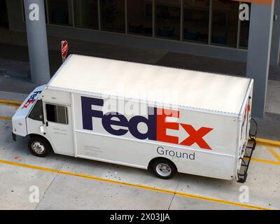 Miami, Florida, United States - April 6, 2024: FedEx truck stopped at a street. Stock Photo