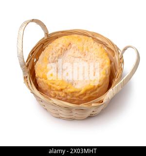 Single French Langres cheese refined with champagne in a basket close up isolated on white background Stock Photo