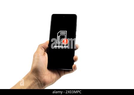 Cellular Problems Concepts. Man hand holding smart phone with full storage icon on screen isolated on white background. All screen graphics are made u Stock Photo