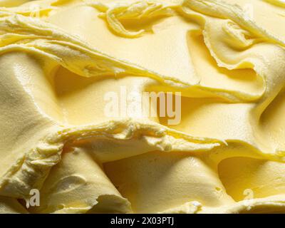 Frozen Pineapple flavour gelato - full frame detail. Close up of a yellow surface texture of Ice cream. Stock Photo