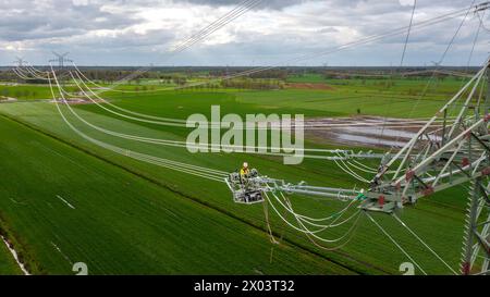 Wiefelstede, Germany. 14th Sep, 2017. Construction work is taking place on new electricity pylons near the Conneforde substation. (Aerial view with a drone) Lower Saxony's Environment Minister Meyer takes a look at the progress of the electricity grid expansion in Lower Saxony and visits a pylon construction site for the energy transition project, which aims to increase transmission capacity in north-western Lower Saxony. Credit: Sina Schuldt/dpa/Alamy Live News Stock Photo