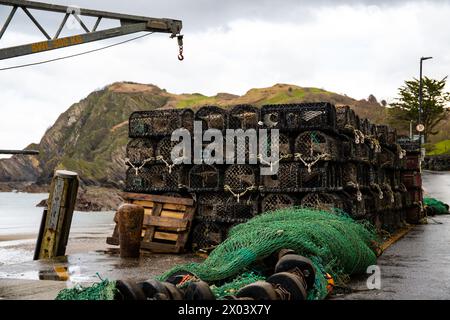 Fishermans village crab cages and nets left by the shores of Ilfracombe England Stock Photo