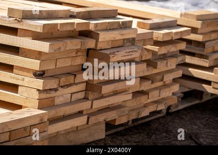 Stack of wooden boards at a construction site. Woodworking industry Stock Photo