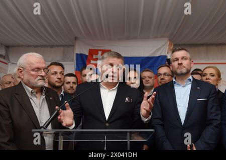 Slovak prime minister Robert Fico (center) speaks to journalists at campaign headquarter of Peter Pellegrini in Bratislava. On right newly elected president Peter Pellegrini and on left is former Slovak president Ivan Gasparovic. Peter Pellegrini, won the presidential elections, outpacing former Slovak foreign minister Ivan Korcok. Stock Photo