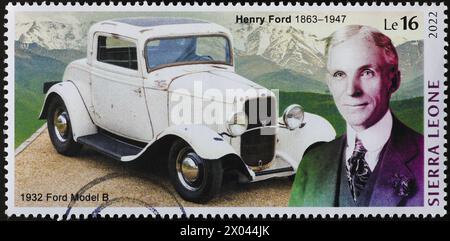 Henry Ford and the model B 0f 1932 on postage stamp Stock Photo