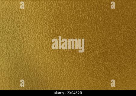 Foil surface. Abstract background from a gilded surface. Stock Photo