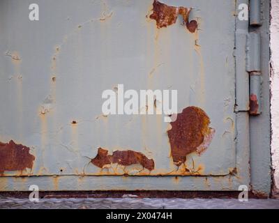 Close-up of an old rusty heavy green metal door Stock Photo