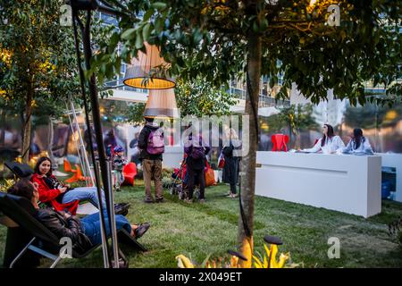 Milan, Italy - April 17, 2019: People relax in the city, surrounded by design installations and finishes, during the Milan designweek Stock Photo